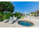 Relaxing backyard featuring a spa and lounge area with stunning lake views at 1502 E Treasure Cove Dr, Gilbert, AZ 85234
