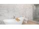 Elegant bathroom with marble tile, freestanding tub, and glass shower at 1502 E Treasure Cove Dr, Gilbert, AZ 85234