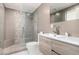 Modern bathroom with large shower, neutral tile, and updated vanity with chrome fixtures at 1502 E Treasure Cove Dr, Gilbert, AZ 85234