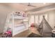This is a well-lit room, complete with white bunkbeds, a teepee, and plenty of natural light at 1502 E Treasure Cove Dr, Gilbert, AZ 85234