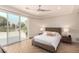 Bedroom with neutral decor and floor to ceiling windows that offer backyard pond views at 1502 E Treasure Cove Dr, Gilbert, AZ 85234