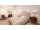 Bright bedroom with herringbone floors, tufted headboard, and classic furnishings at 1502 E Treasure Cove Dr, Gilbert, AZ 85234