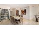 Dining room with a wine fridge, modern art, and contemporary furnishings at 1502 E Treasure Cove Dr, Gilbert, AZ 85234