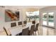 Dining room with lake view, modern chandelier, and contemporary furnishings at 1502 E Treasure Cove Dr, Gilbert, AZ 85234