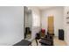 Exercise room with Pilates machine, large mirror, motivational writing on wall, and tiled floor at 1502 E Treasure Cove Dr, Gilbert, AZ 85234