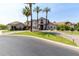 Beautiful two-story home with lush landscaping, green lawn and a circular driveway at 1502 E Treasure Cove Dr, Gilbert, AZ 85234
