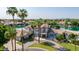 Waterfront luxury home with lush landscaping and tile roof at 1502 E Treasure Cove Dr, Gilbert, AZ 85234