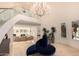 Elegant foyer with soaring ceilings, chandelier, and curved staircase at 1502 E Treasure Cove Dr, Gilbert, AZ 85234