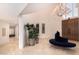 Elegant foyer with soaring ceilings, chandelier, and curved staircase at 1502 E Treasure Cove Dr, Gilbert, AZ 85234