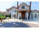 Stately luxury home with porte cochere and lush landscaping at 1502 E Treasure Cove Dr, Gilbert, AZ 85234