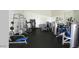 Well-equipped home gym with various weight machines and ample space for fitness activities at 1502 E Treasure Cove Dr, Gilbert, AZ 85234