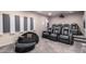 Home theater room with reclining leather chairs, projector, movie screen, and soundproofing panels at 1502 E Treasure Cove Dr, Gilbert, AZ 85234