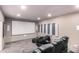 Home theater room with reclining leather chairs, projector, movie screen, and soundproofing panels at 1502 E Treasure Cove Dr, Gilbert, AZ 85234