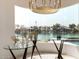 Stunning lake view through floor-to-ceiling windows in the dining area at 1502 E Treasure Cove Dr, Gilbert, AZ 85234