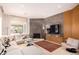 Modern living room featuring a fireplace, TV, and comfortable seating area at 1502 E Treasure Cove Dr, Gilbert, AZ 85234