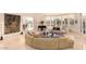 Expansive living room with large windows, luxury furniture, and water view at 1502 E Treasure Cove Dr, Gilbert, AZ 85234