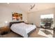 This main bedroom features a large window with a lake view, and lots of natural light at 1502 E Treasure Cove Dr, Gilbert, AZ 85234