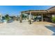 Spacious outdoor patio with covered seating area overlooking the waterfront at 1502 E Treasure Cove Dr, Gilbert, AZ 85234