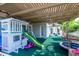 Covered outdoor play area with playset, slide, trampoline, and swings for Gathering fun at 1502 E Treasure Cove Dr, Gilbert, AZ 85234