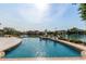 Beautiful pool overlooking a tranquil lake, creating a serene backyard oasis at 1502 E Treasure Cove Dr, Gilbert, AZ 85234