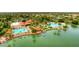 The aerial view shows a pool, clubhouse, and a nearby lake for an idyllic community setting at 1502 E Treasure Cove Dr, Gilbert, AZ 85234