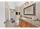Bathroom with a single sink vanity, granite countertops, and tile flooring, and a walk-in shower at 15226 N 51St St, Scottsdale, AZ 85254