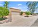 Exterior view of home featuring driveway, desert landscaping, and multi-car garage at 15226 N 51St St, Scottsdale, AZ 85254