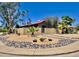 Charming single-story home with desert landscaping, palm trees, and a beautiful walkway at 15226 N 51St St, Scottsdale, AZ 85254