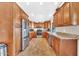 Spacious kitchen with stainless steel appliances, wood cabinets, and granite countertops, offering ample storage at 15226 N 51St St, Scottsdale, AZ 85254