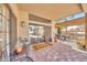 Covered brick patio with desert plants, dark metal furniture and view of backyard at 15226 N 51St St, Scottsdale, AZ 85254