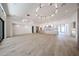 Open-concept living room featuring sleek hardwood floors and modern lighting fixtures at 1538 W Wagon Wheel Dr, Phoenix, AZ 85021
