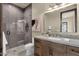 Modern bathroom featuring a glass-enclosed shower, granite countertop, and stylish tile flooring at 16119 N Desert Fox Pkwy, Fountain Hills, AZ 85268