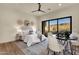 Comfortable bedroom with a view of the mountain landscape, featuring a ceiling fan and stylish decor at 16119 N Desert Fox Pkwy, Fountain Hills, AZ 85268