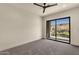 Minimalist bedroom with large windows offering natural light and scenic views at 16119 N Desert Fox Pkwy, Fountain Hills, AZ 85268