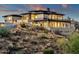 Hillside property boasting a modern exterior, stone facade, an attached guest house and ample outdoor spaces at 16119 N Desert Fox Pkwy, Fountain Hills, AZ 85268