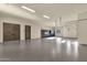 Spacious three car garage with epoxy floor, cabinets and ample lighting at 16119 N Desert Fox Pkwy, Fountain Hills, AZ 85268