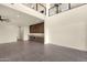 Expansive living room boasts soaring ceilings, stylish wet bar, and sleek tile flooring for a modern touch at 16119 N Desert Fox Pkwy, Fountain Hills, AZ 85268