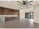 Open floor plan featuring custom bar/kitchenette area with bright lighting and ample space at 16119 N Desert Fox Pkwy, Fountain Hills, AZ 85268