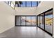 Spacious living room with high ceilings, tile floors, and large windows offering scenic views at 16119 N Desert Fox Pkwy, Fountain Hills, AZ 85268