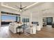 Spacious living room featuring high ceilings, a modern fireplace, and scenic outdoor views at 16119 N Desert Fox Pkwy, Fountain Hills, AZ 85268