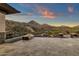 Outdoor patio with a cozy fireplace and scenic mountain views, perfect for entertaining or relaxation at 16119 N Desert Fox Pkwy, Fountain Hills, AZ 85268