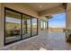 Covered patio featuring sliding doors and scenic views for seamless indoor-outdoor living at 16119 N Desert Fox Pkwy, Fountain Hills, AZ 85268