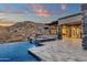 This home features a stunning outdoor pool, spa, and patio with a mountain view at 16119 N Desert Fox Pkwy, Fountain Hills, AZ 85268