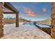 This home features a pool, spa, firepit, travertine tile patio, and outdoor kitchen with mountain views at 16119 N Desert Fox Pkwy, Fountain Hills, AZ 85268