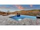 Stunning infinity pool overlooking mountain views creates a serene outdoor retreat at 16119 N Desert Fox Pkwy, Fountain Hills, AZ 85268