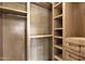 Custom designed walk-in closet with organized shelving and storage for an optimized wardrobe at 16119 N Desert Fox Pkwy, Fountain Hills, AZ 85268