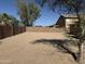 Spacious backyard surrounded by privacy walls, offering a blank canvas for landscaping at 1930 W Burgess Ln, Phoenix, AZ 85041