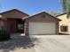 Charming single-story home featuring a 2-car garage and low-maintenance desert landscaping at 1930 W Burgess Ln, Phoenix, AZ 85041