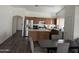 Well-lit kitchen featuring stainless steel appliances, a functional island, and a view of dining area at 1930 W Burgess Ln, Phoenix, AZ 85041