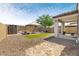 Relaxing backyard offers ample space with covered patio at 19664 W Woodlands Ave, Buckeye, AZ 85326